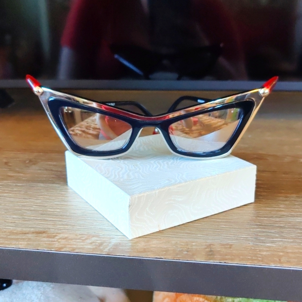 Moschino silver mirror lenses glasses. Very original and cool.